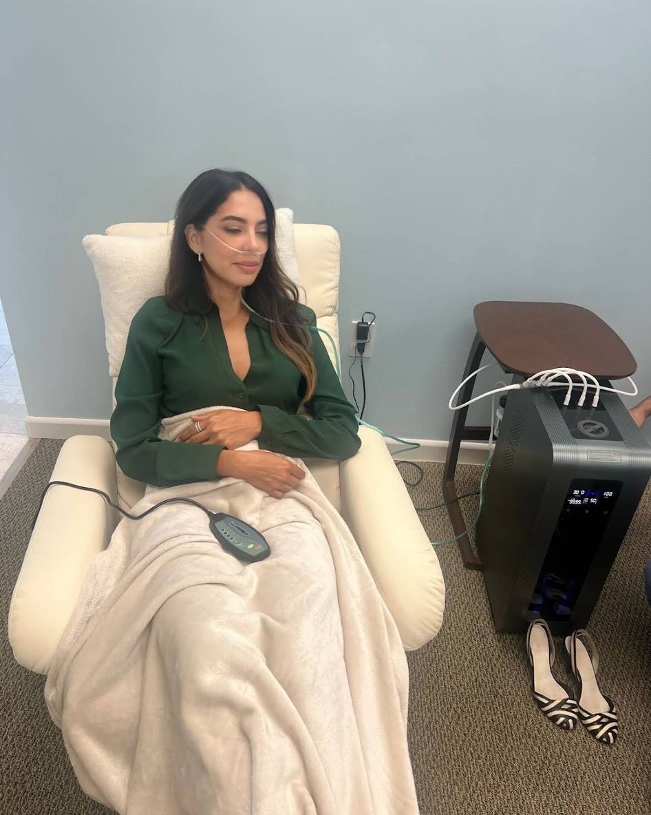 Patient receiving ozone therapy treatment in a comfortable medspa setting